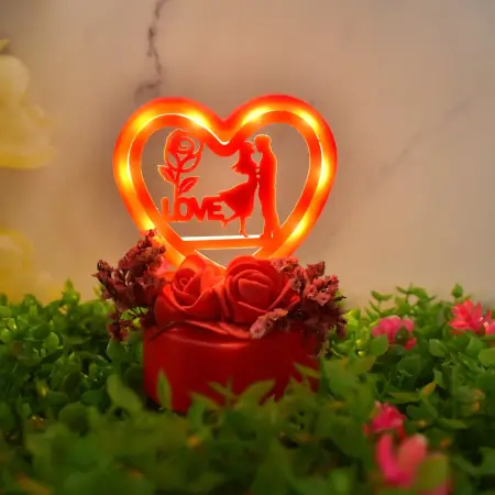 Romantic Heart-Shaped Love Couple Decorative Showpiece with Rose Base LED Light – Tabletop Gift for Home Decor, Anniversary, Valentine’s Day & Special Occasions (Battery Not Included) – 1 Pc
